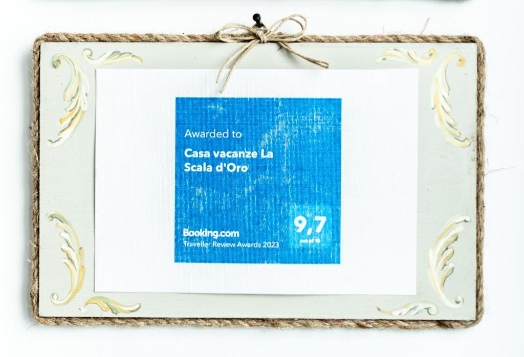 Certifikát, ocenenie alebo iný dokument vystavený v ubytovaní Casa vacanze La Scala d'Oro