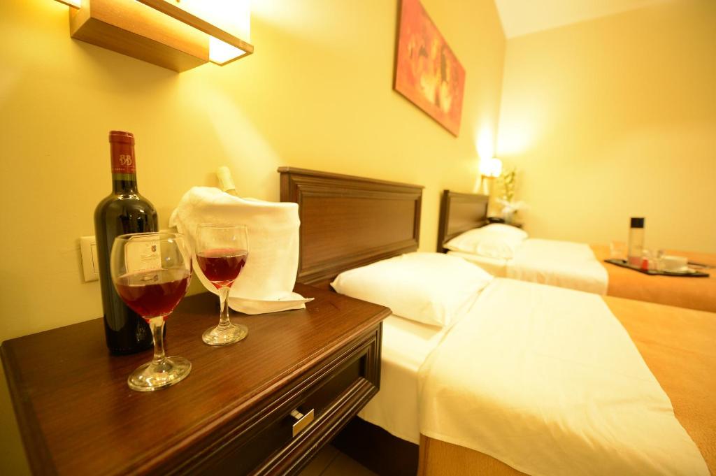 Postel nebo postele na pokoji v ubytování Central Hotel