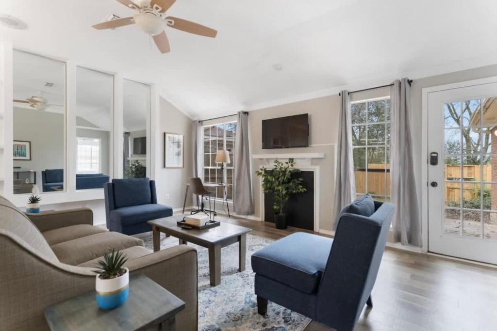 a living room with a couch and chairs and a ceiling fan at Fenced Yard Near Shops & Dining- Capital City Gem in Montgomery