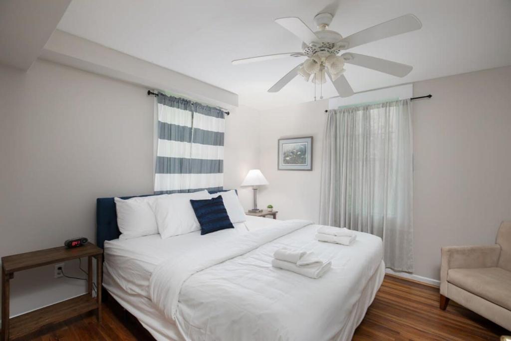 a bedroom with a white bed and a ceiling fan at Redmont Revival-Unit B-Walkable-UAB in Birmingham
