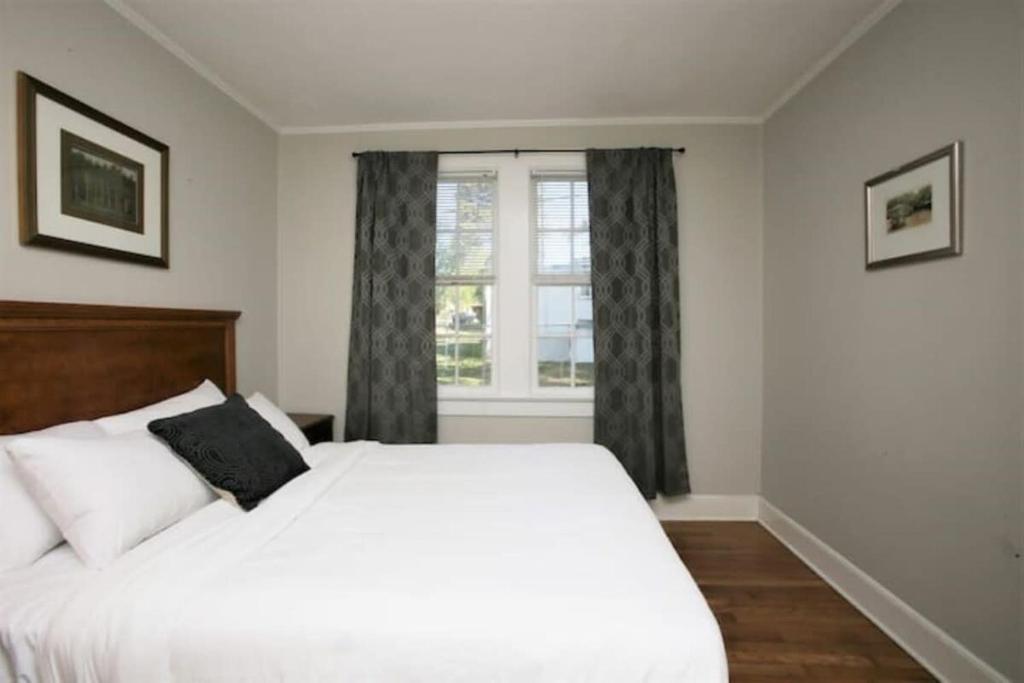 a bedroom with a white bed and a window at Lovely on Lorick-USC, Jackson, Pets, Wifi in Columbia