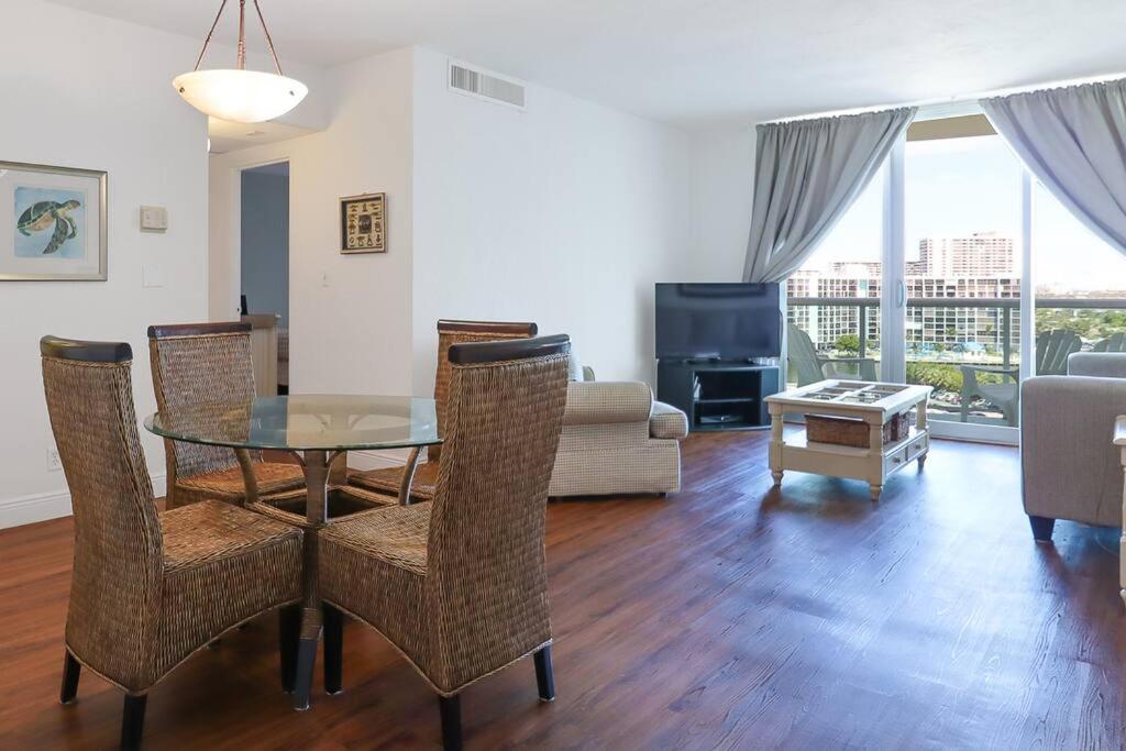 a living room with a table and chairs and a couch at Komffy Home w/ 2 Queen Beds & Ocean View at Tides in Hollywood