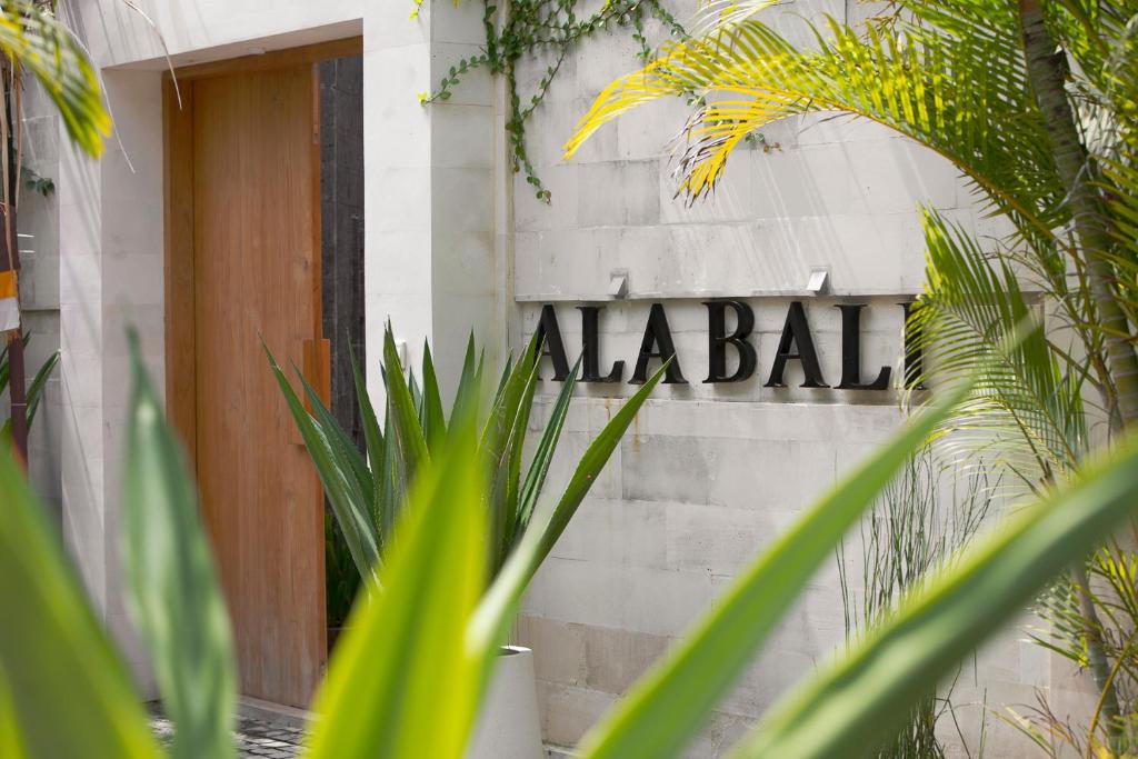 a sign for malabar on the side of a building at Villa Alabali in Seminyak