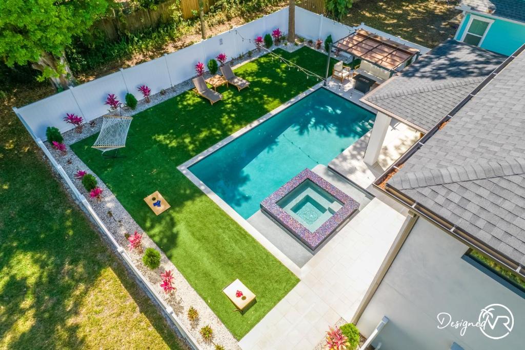 an overhead view of a backyard with a swimming pool at Luxury Tampa Home w Pool Jacuzzi & Amenities in Tampa