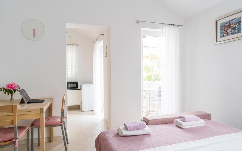 Postel nebo postele na pokoji v ubytování Apartments Lila