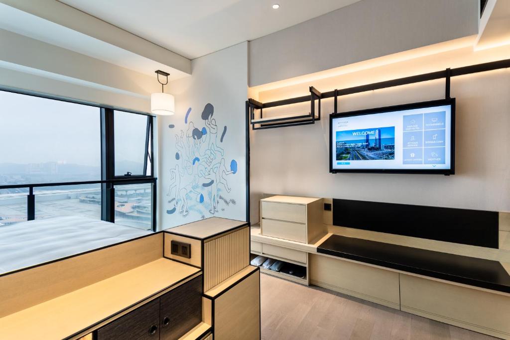 Postel nebo postele na pokoji v ubytování Artyzen Habitat Hengqin Zhuhai