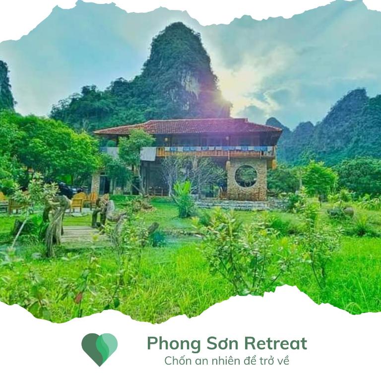 a building in a field with a mountain in the background at Phong Sơn Retreat - Hữu Lũng, Lạng Sơn in Lạng Sơn
