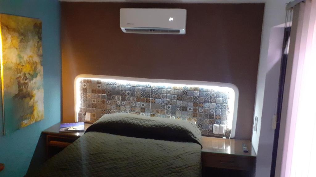 Voodi või voodid majutusasutuse Aparta-Hotel CASA REAL Apartamentos toas