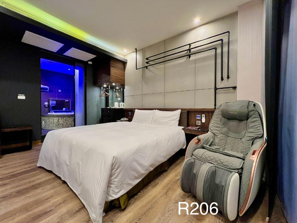 Postel nebo postele na pokoji v ubytování Catwalk Motel -Tainan