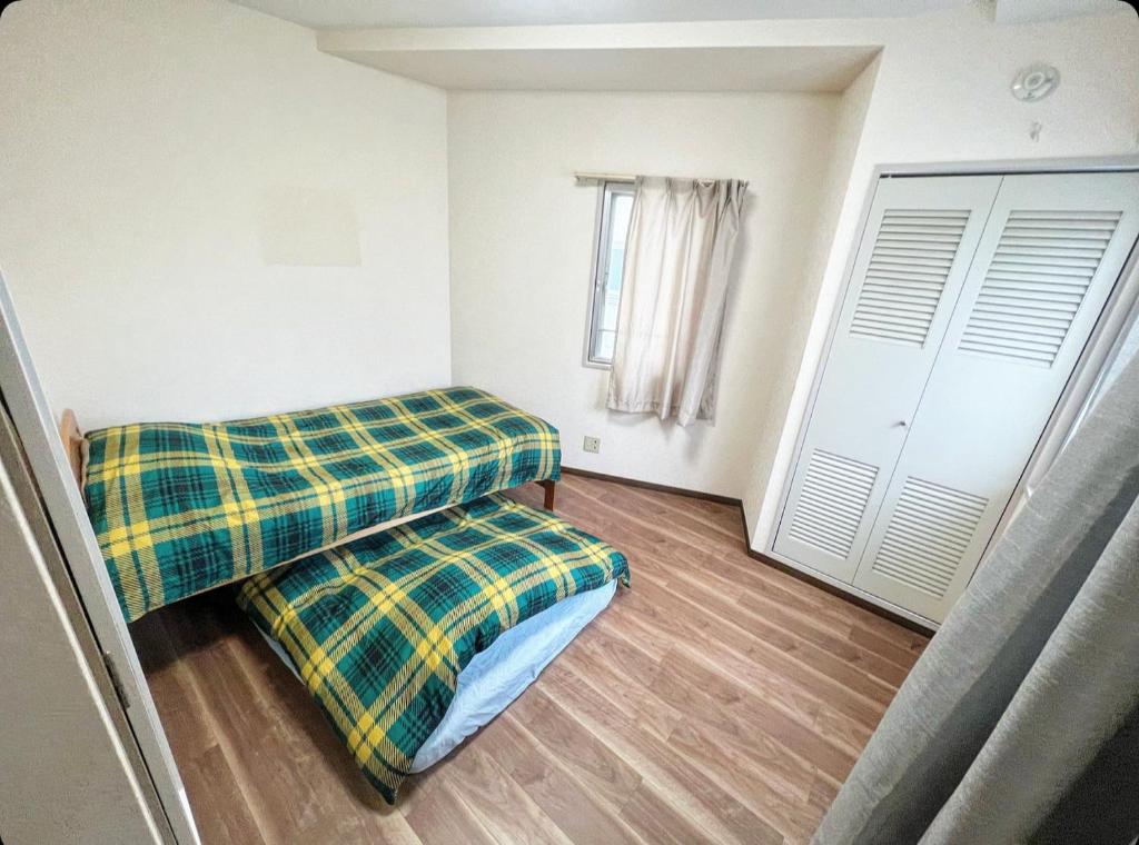 Postel nebo postele na pokoji v ubytování MATUBARA HOUSE