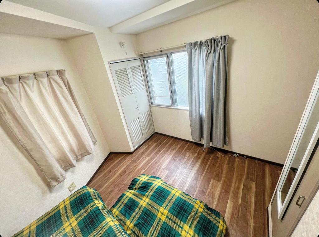 Postel nebo postele na pokoji v ubytování MATUBARA HOUSE