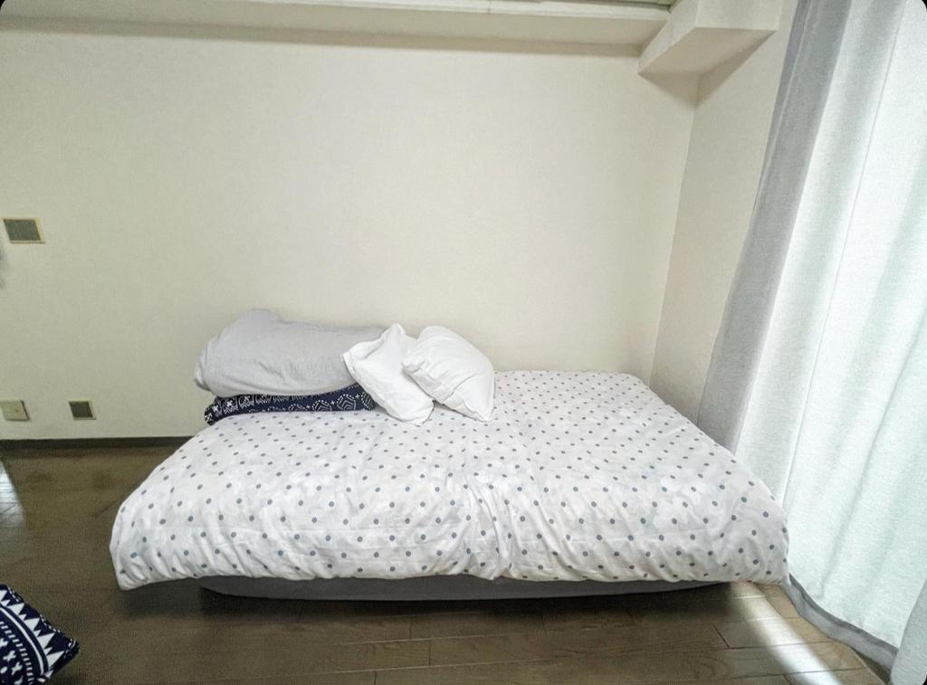 Postel nebo postele na pokoji v ubytování MATUBARA HOUSE