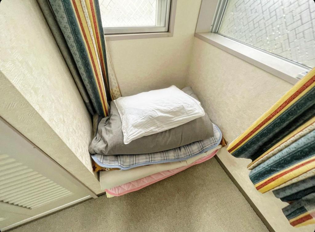 Postel nebo postele na pokoji v ubytování MATUBARA HOUSE