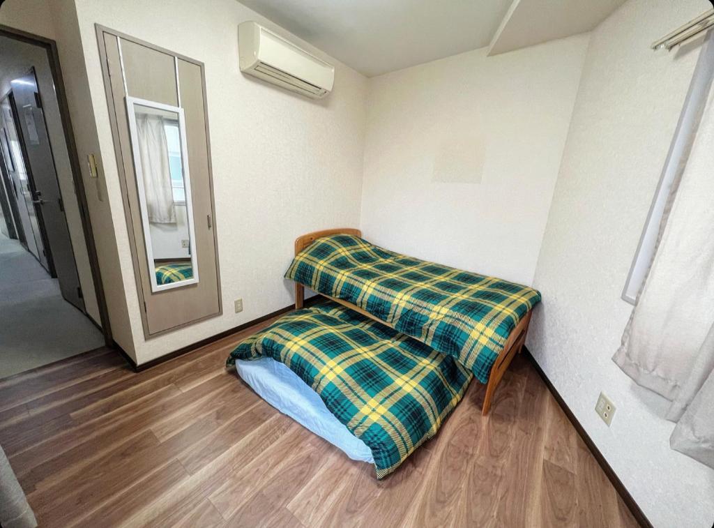 Postel nebo postele na pokoji v ubytování MATUBARA HOUSE