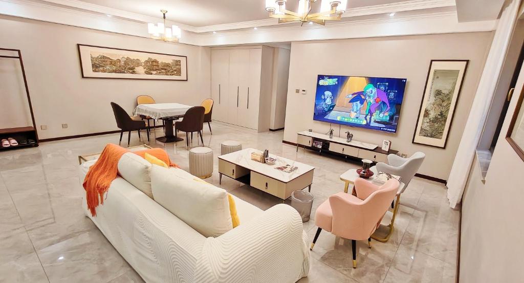 Televiisor ja/või meelelahutuskeskus majutusasutuses Ancient City Wall Home Apartment Xi'an