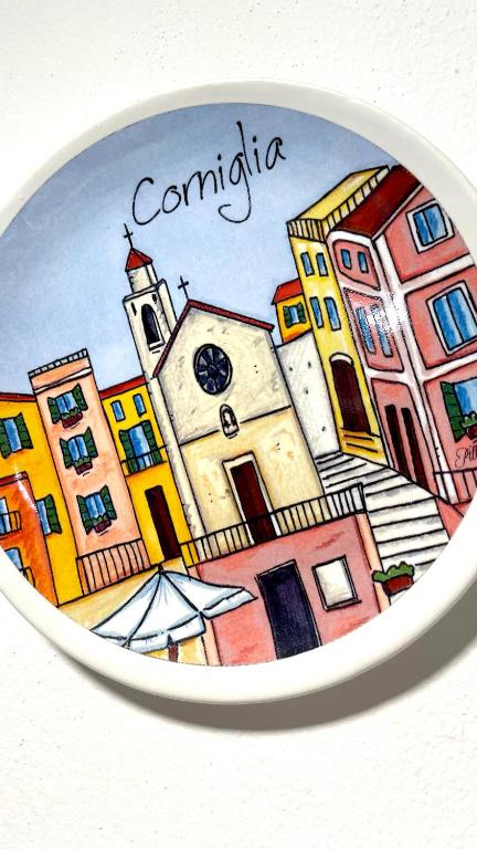 a plate with a drawing of a city at La Scuna Apartments in Corniglia