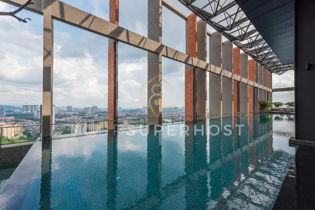 a swimming pool on the top of a building at Millerz Square Tower E Near MidValley by YourSuperhost in Kuala Lumpur