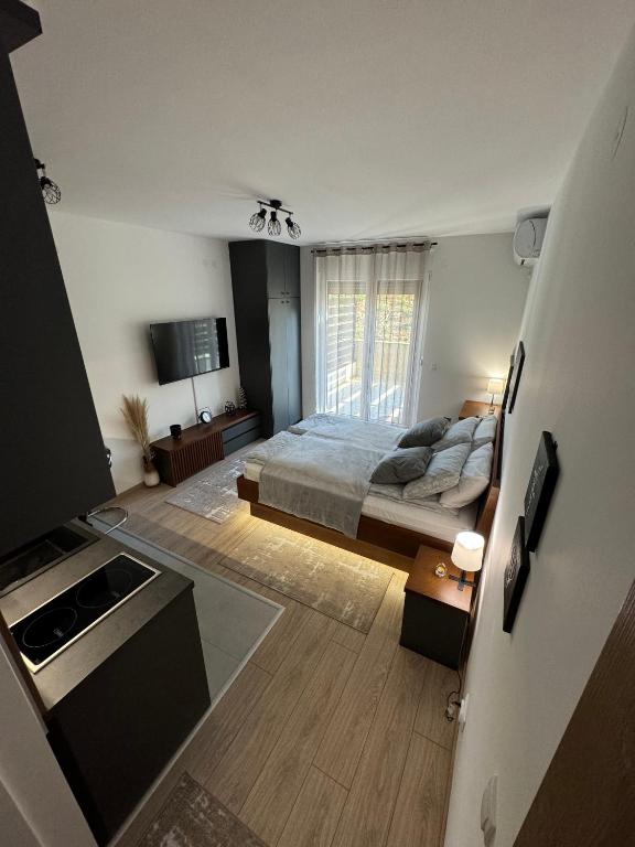 Postel nebo postele na pokoji v ubytování Apartmani Viver Vrnjačka Banja