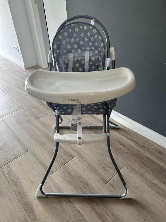 a black and white chair sitting in a room at Canyelles BBQ Apartment in Lloret de Mar