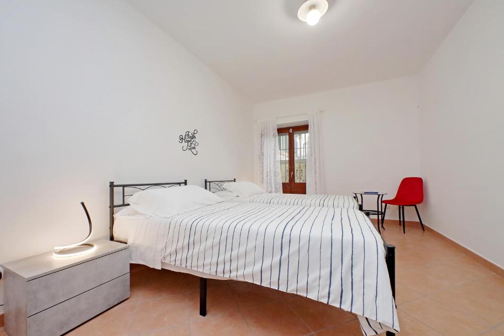 Voodi või voodid majutusasutuse Home and Garden Le Rondini toas
