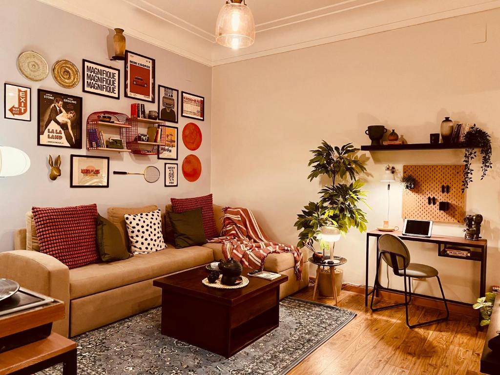 a living room with a couch and a table at Retro Nutshell! in Cairo