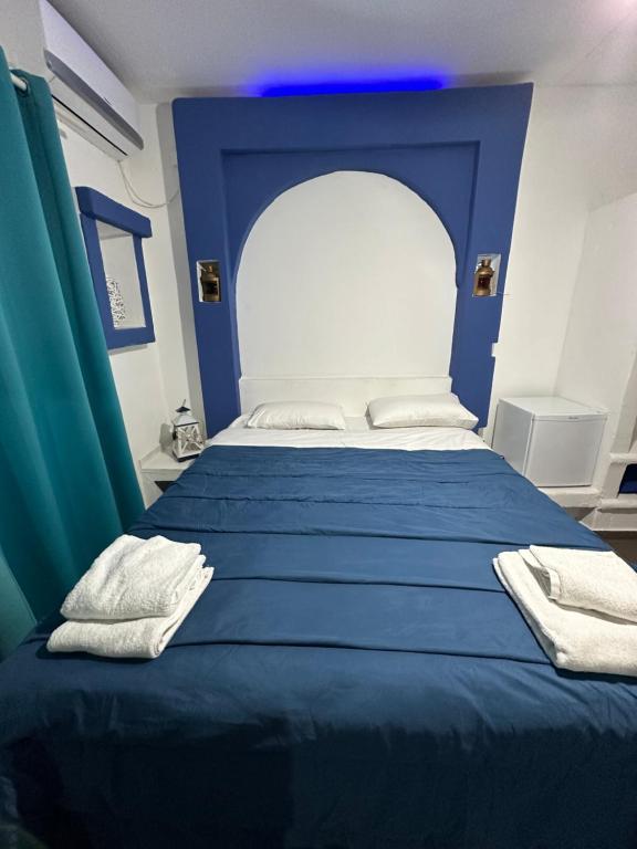 Voodi või voodid majutusasutuse Naval Hotel Aegina toas