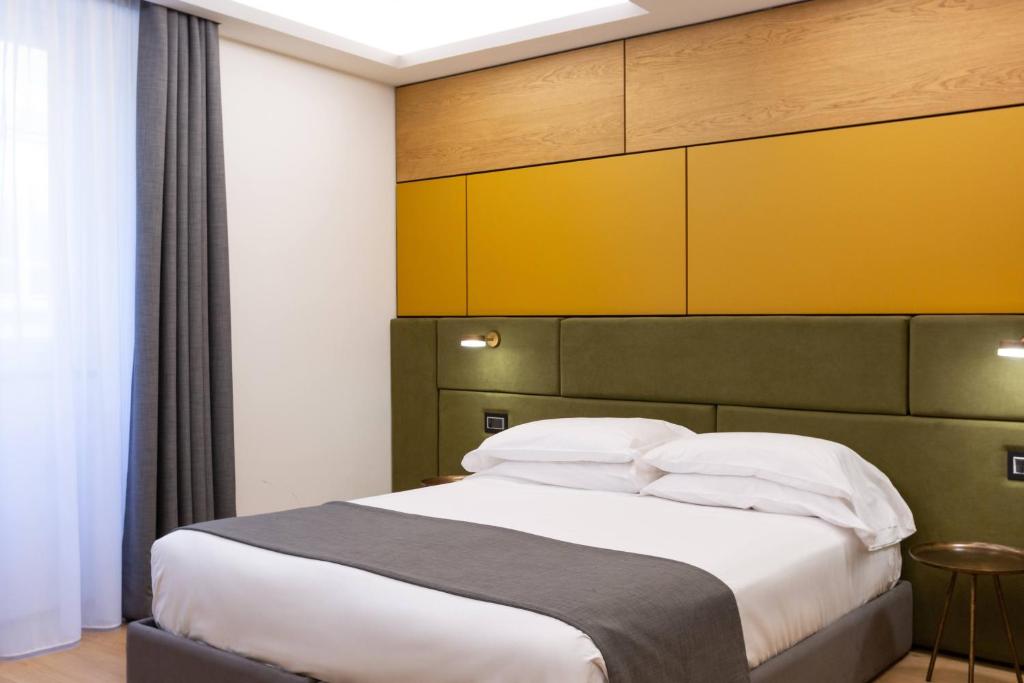 Postel nebo postele na pokoji v ubytování Hotel Silla