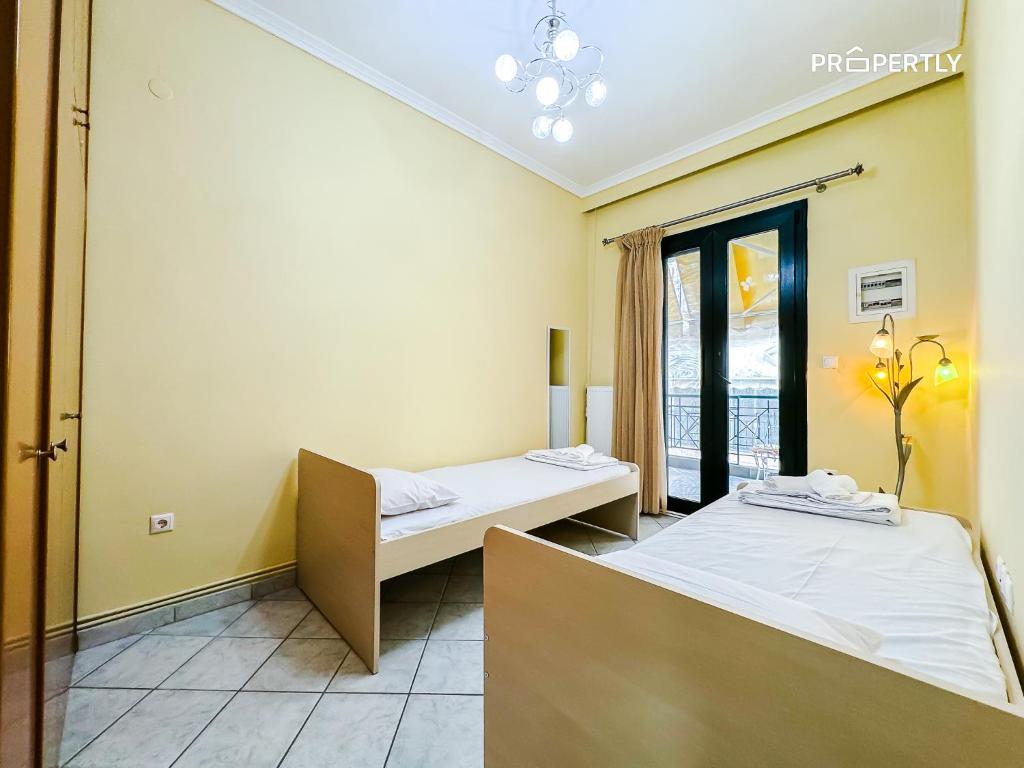 Postel nebo postele na pokoji v ubytování Kate Seaside Apartment