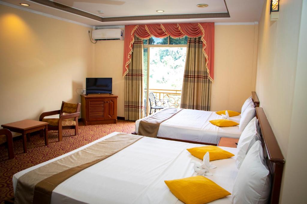 Postel nebo postele na pokoji v ubytování Hotel Lakefield