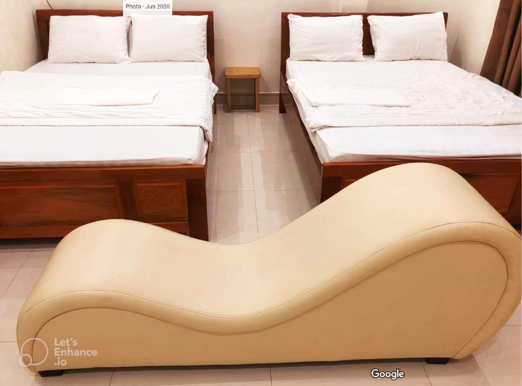 Ein Bett oder Betten in einem Zimmer der Unterkunft Nhà nghỉ Thành Công