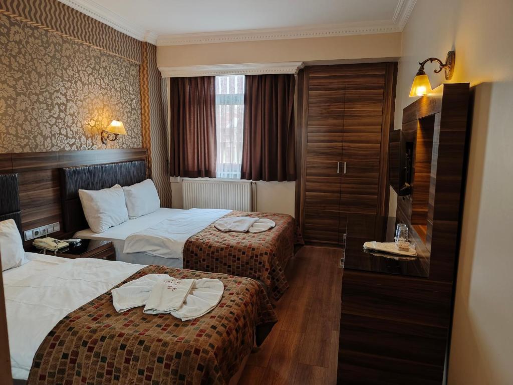 Postel nebo postele na pokoji v ubytování Hotel Bazaar