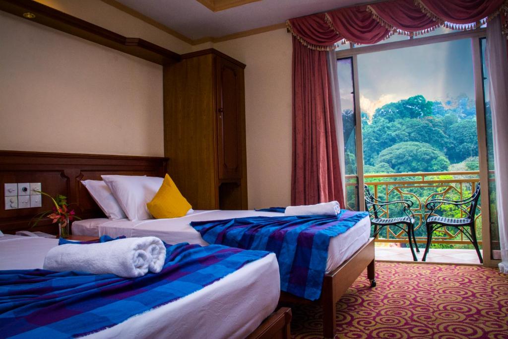 Postel nebo postele na pokoji v ubytování Hotel Lakefield