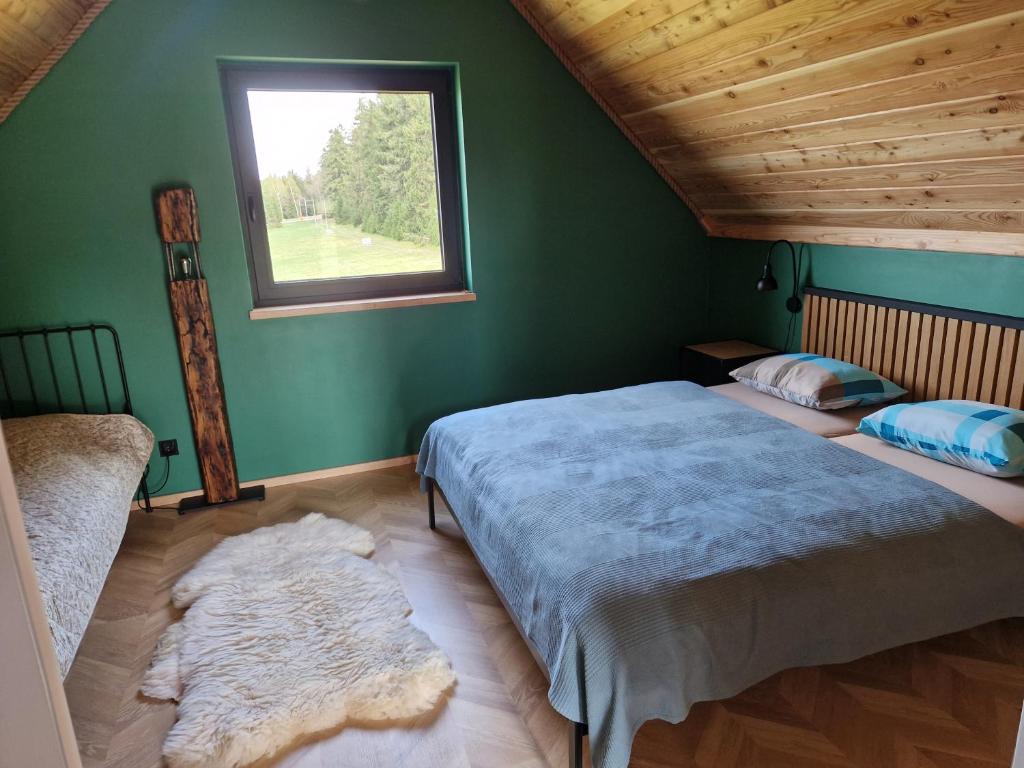 Postelja oz. postelje v sobi nastanitve Domek pod Jagodną 824 m n.p.m. Spalona 6 BE