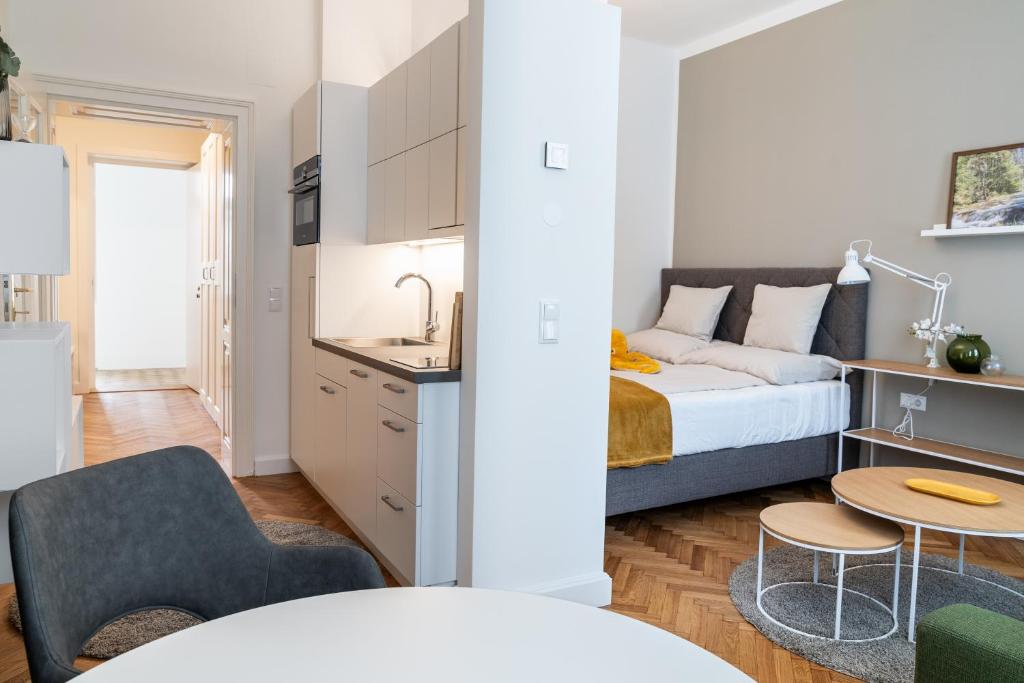 Postel nebo postele na pokoji v ubytování twenty five - work & life Apartments