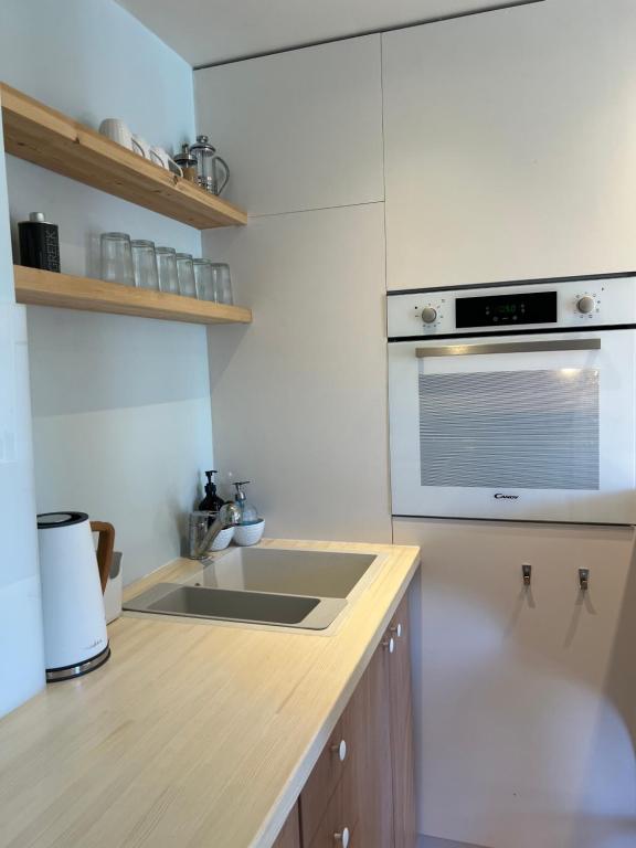Kuchyň nebo kuchyňský kout v ubytování Kapella Apartments
