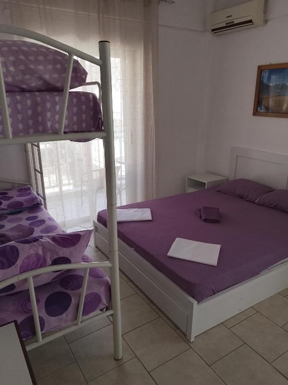 Postel nebo postele na pokoji v ubytování Aleksandros Olimp