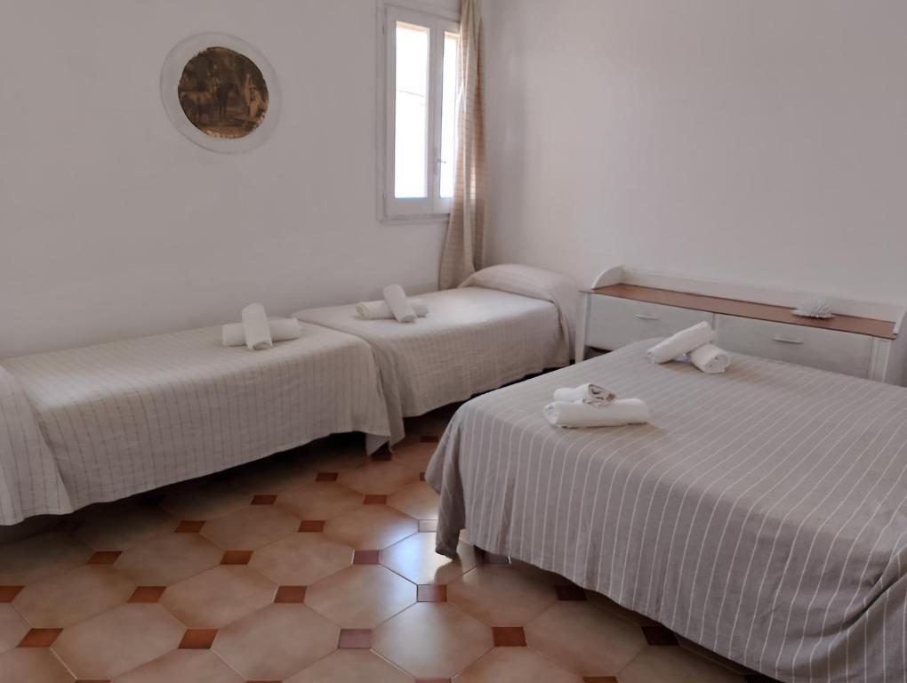 Postel nebo postele na pokoji v ubytování La dimora di nonna Giuliana