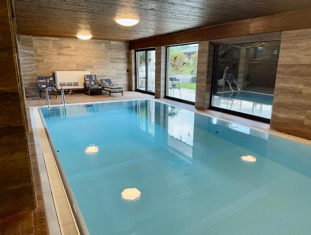 a large swimming pool in a house at Haus Wenger Mountain View & Swimming Pool in Kaprun