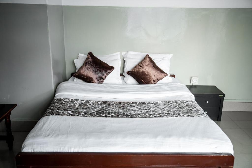 Postel nebo postele na pokoji v ubytování 2K HOTEL
