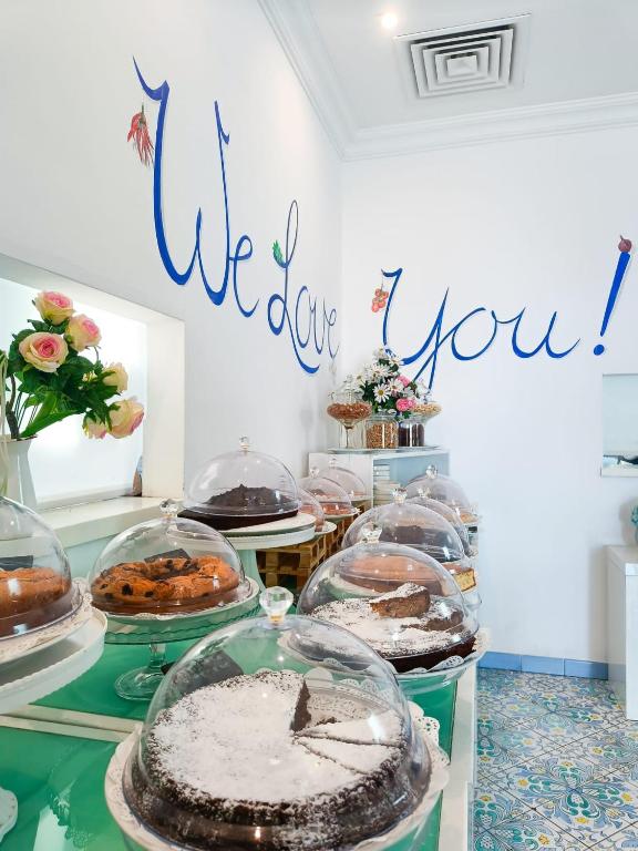 a table with many different types of cakes and pastries at Relais Maresca Luxury Small Hotel & Terrace Restaurant in Capri