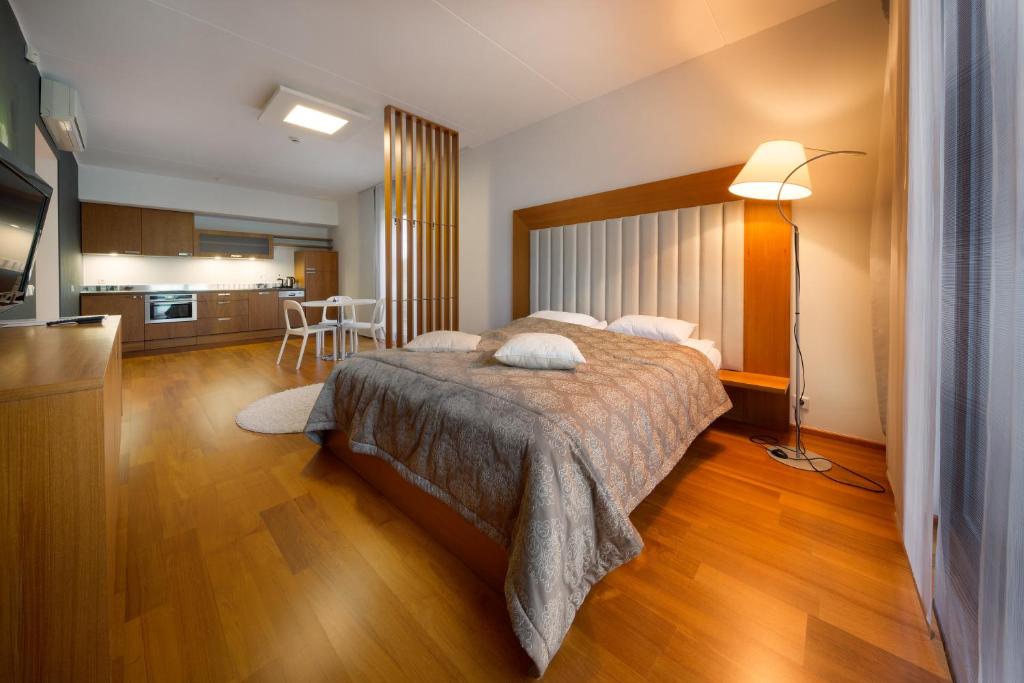 Postel nebo postele na pokoji v ubytování GMP Clubhotel Apartments
