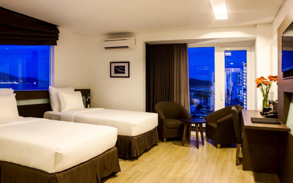 Postel nebo postele na pokoji v ubytování Ocean View Nha Trang