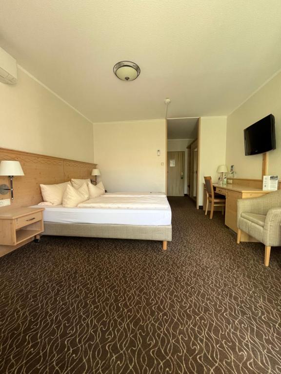 Postel nebo postele na pokoji v ubytování AMBER HOTEL Bavaria