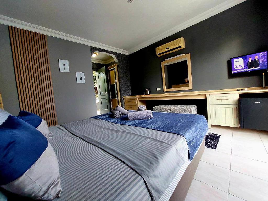 Postel nebo postele na pokoji v ubytování Summer rose hotel