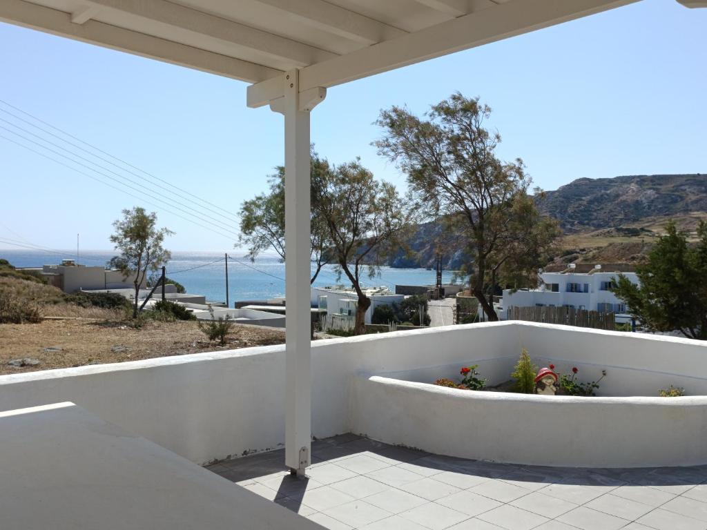 a white porch with a view of the ocean at Summer House Paliochori in Paliochori