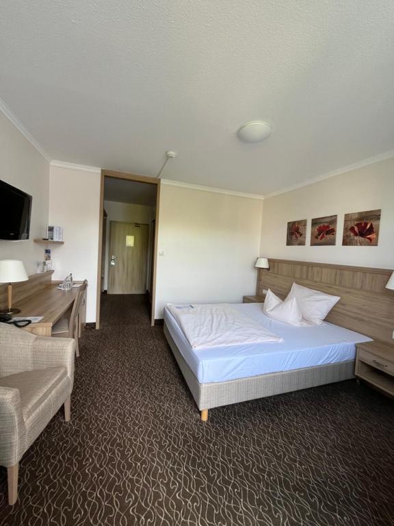 Postel nebo postele na pokoji v ubytování AMBER HOTEL Bavaria