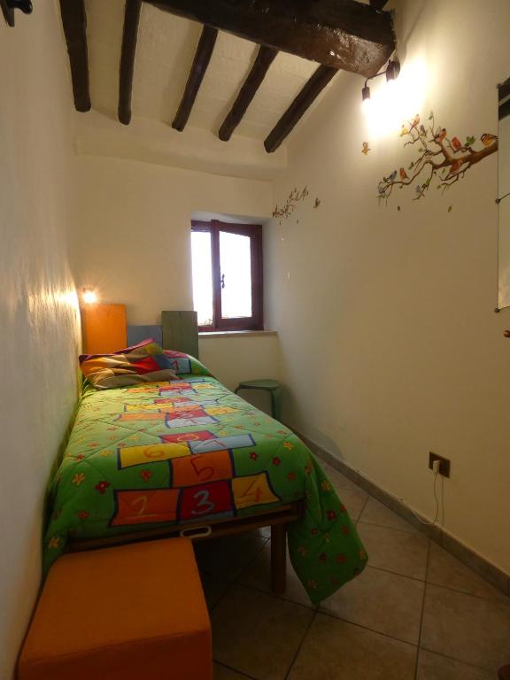 Postel nebo postele na pokoji v ubytování SCAPPO IN UMBRIA, CasaLina
