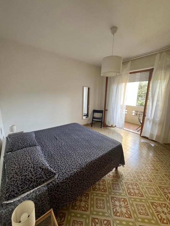 Łóżko lub łóżka w pokoju w obiekcie Casa Palma - 300mt dal Mare