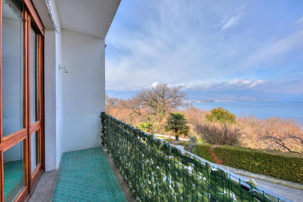 a balcony with a view of the water at La Finestra Sul Lago - Happy Rentals in Stresa