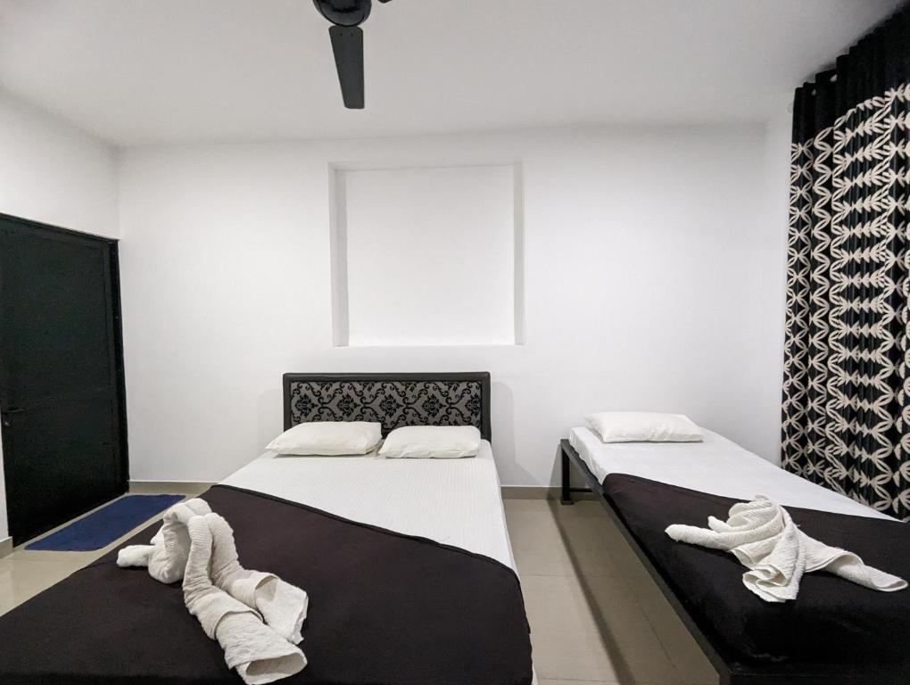 Postel nebo postele na pokoji v ubytování Big John Hotel